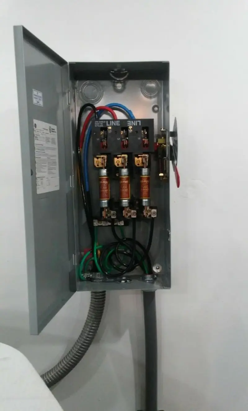 Three-phase disconnect switch installed for Smoke Detector Installation in Eustis