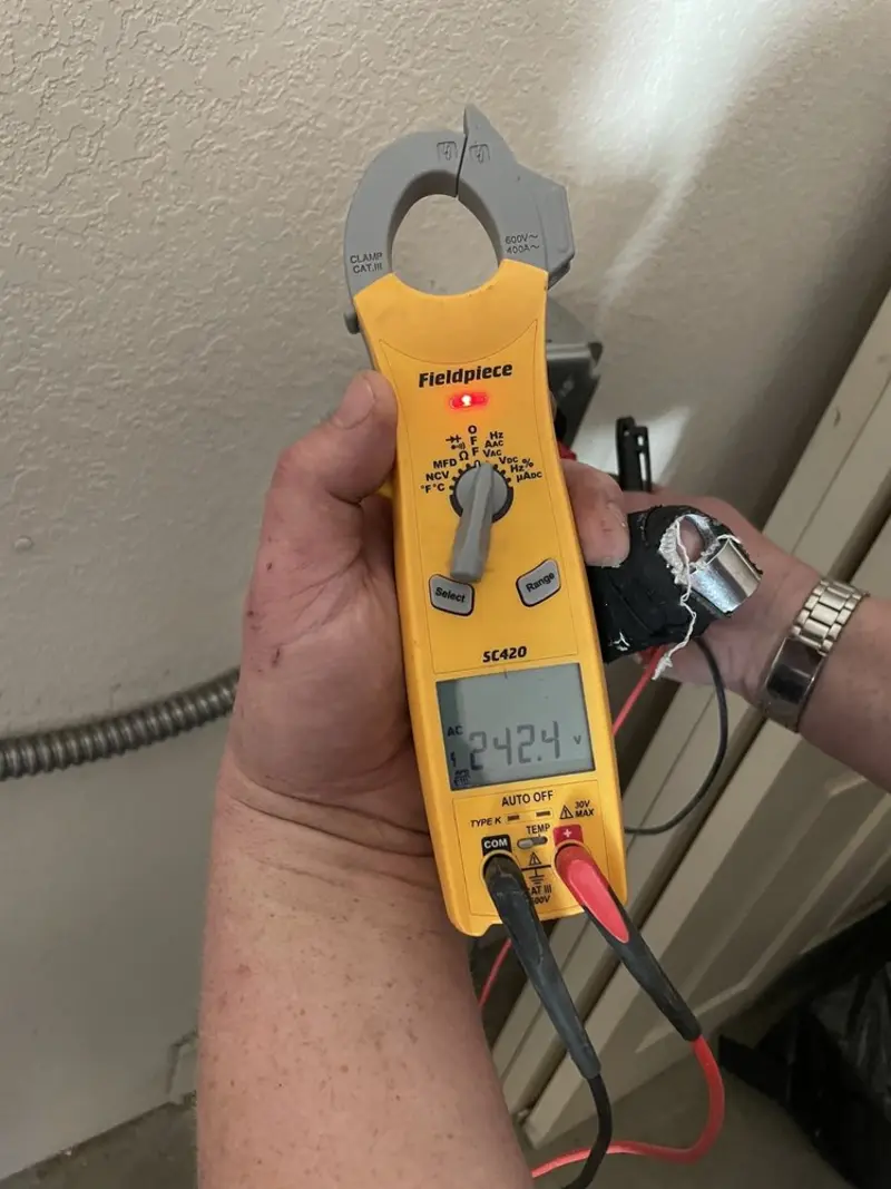 Voltage testing with clamp meter during Electrical Installation Services in Eustis